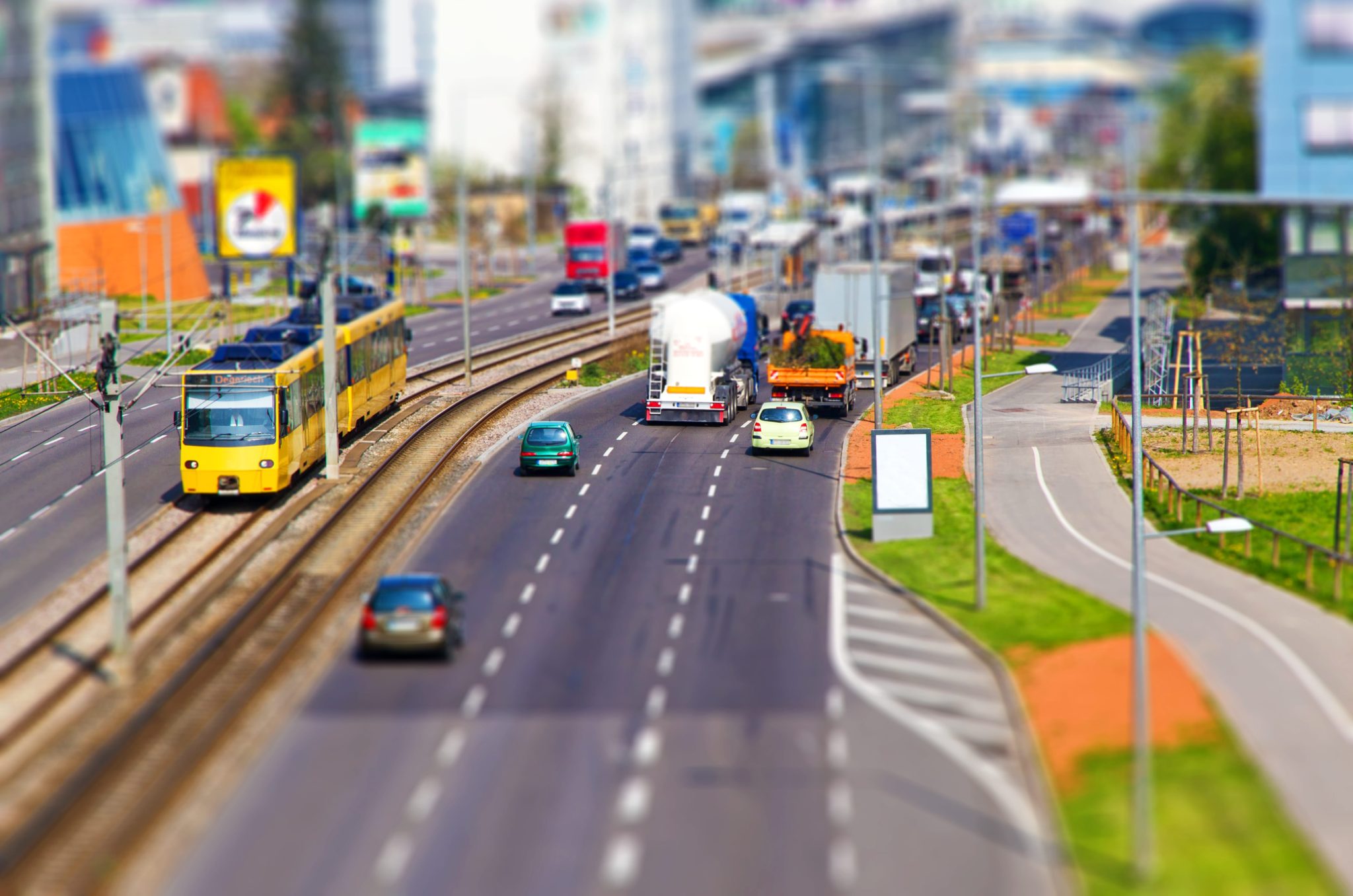 miniature of a busy street with cars and trains